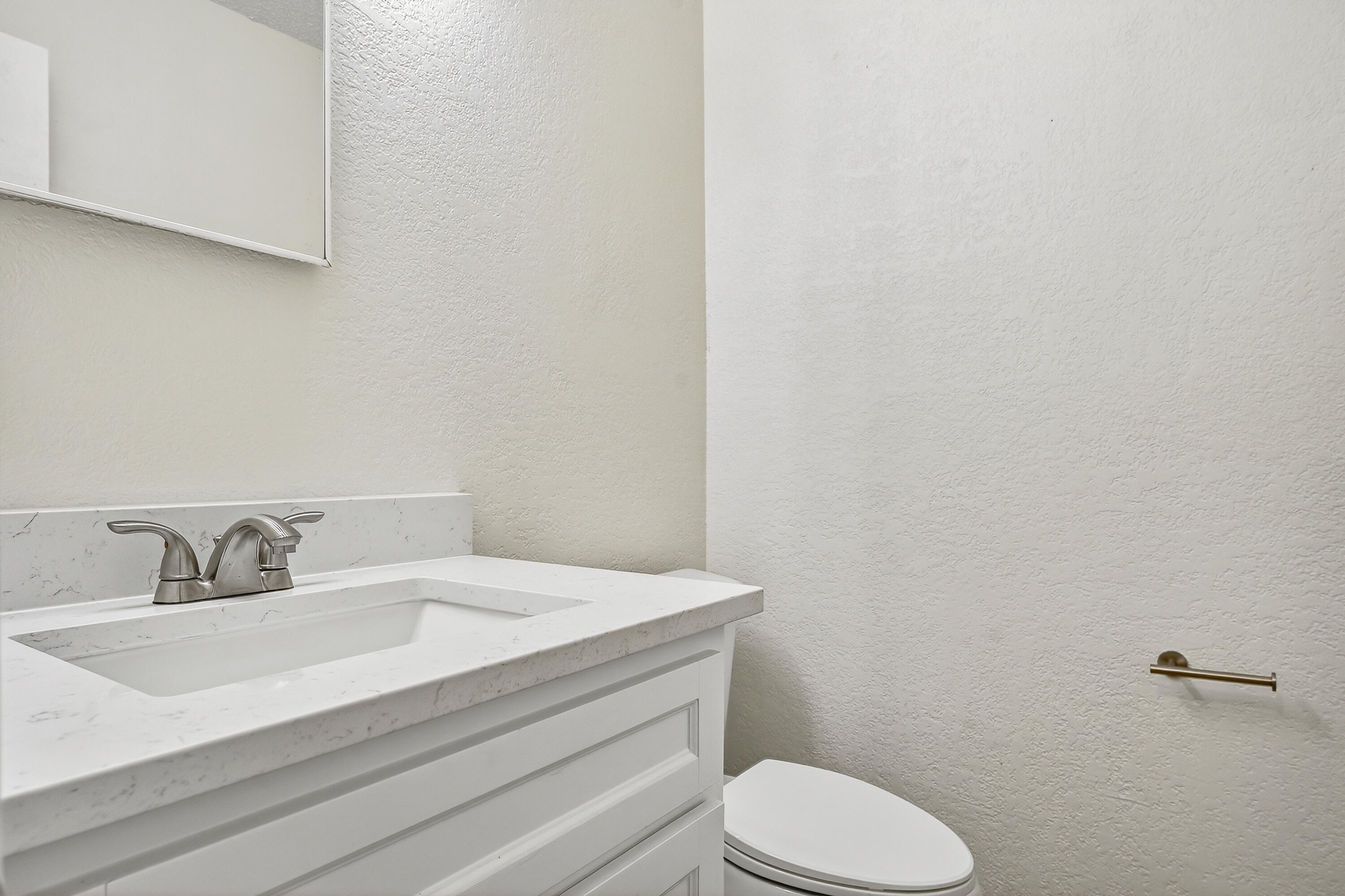 5751 38th Street Lubbock, TX 79407 - Photo 9 of 22 a bathroom with a sink and a toilet