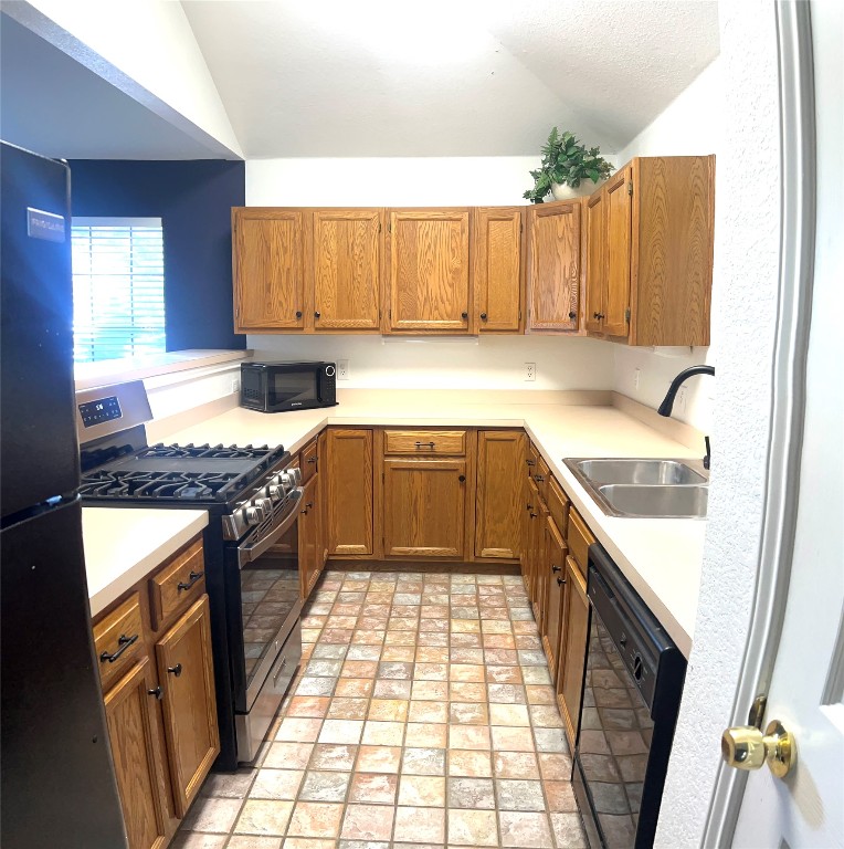 1747 Windy Park Circle Round Rock, TX 78664 - Photo 4 of 12 a kitchen with a sink stove and cabinets