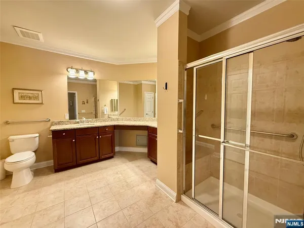 a bedroom with furniture and a flat screen tv