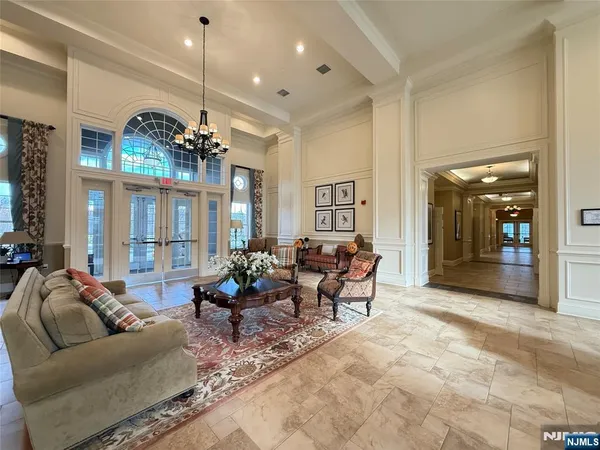 a room with pool table and windows