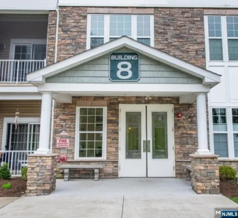 a front view of a house with a large window