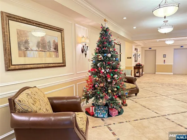 a living room with furniture and flowers