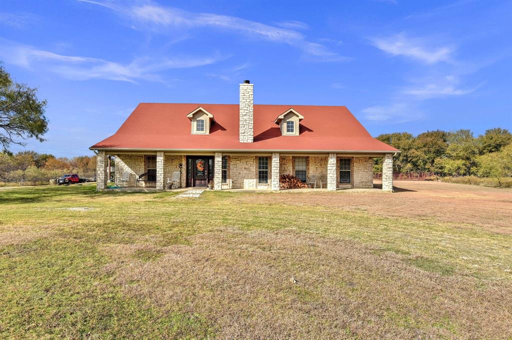 14771 Shearer Road Pilot Point, TX 76258 - Photo 27 of 36 a front view of a house with a yard