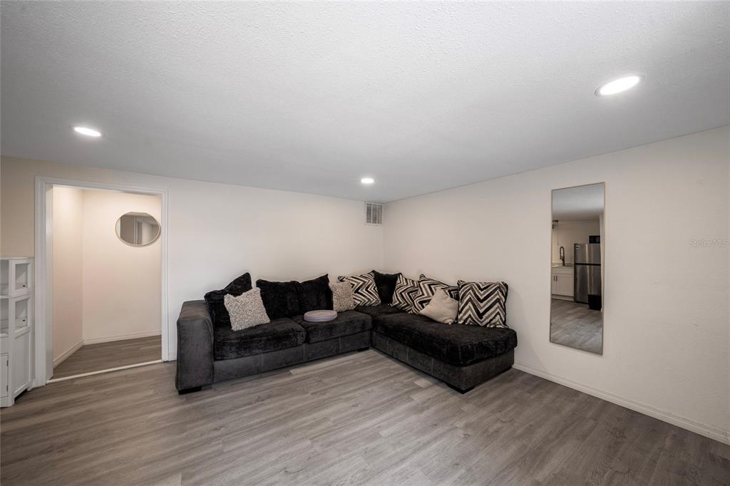 357 Ridgewood Street Altamonte Springs, FL 32701 - Photo 30 of 36 a living room with furniture and wooden floor