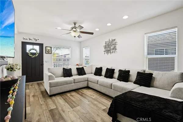 a living room with furniture and a large window