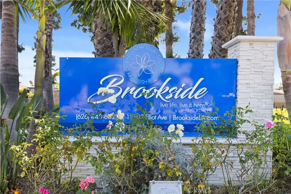 a sign that is on a brick wall