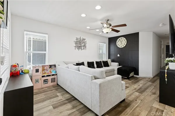 a living room with furniture and a window