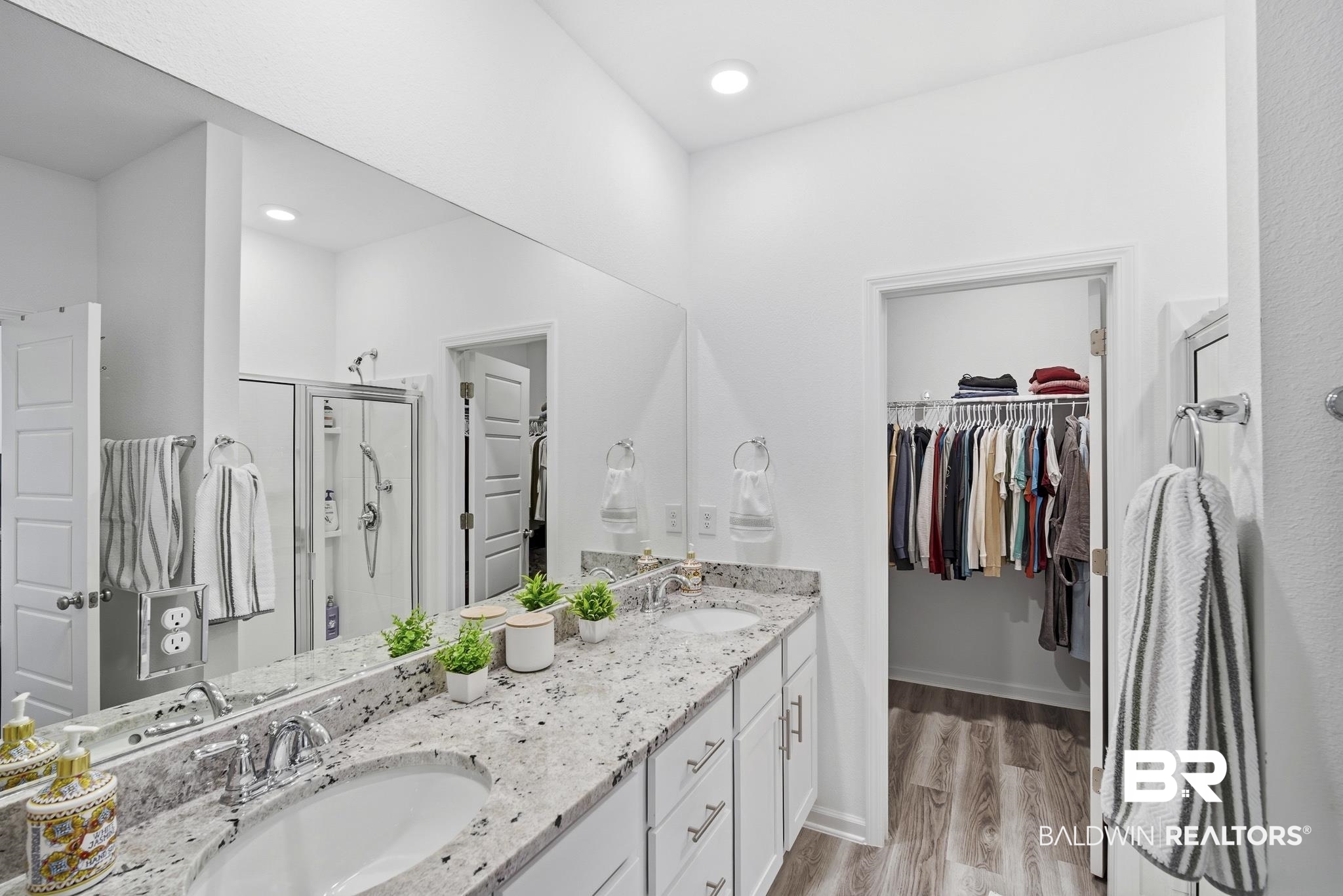 13887 Antler Hl Road Daphne, AL 36527 - Photo 19 of 50 Full bath with a shower stall, double vanity, light wood-style floors, and a walk in closet