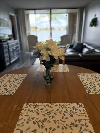 a living room with couch and large window