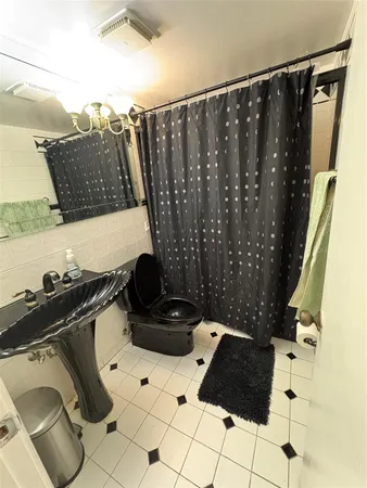 a view of a closet with wooden floor