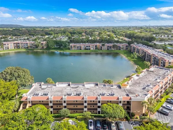 an aerial view of a house with a lake view