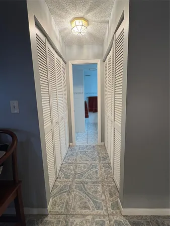 a spacious bathroom with a double vanity sink and a mirror