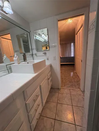 a kitchen with a sink and cabinets