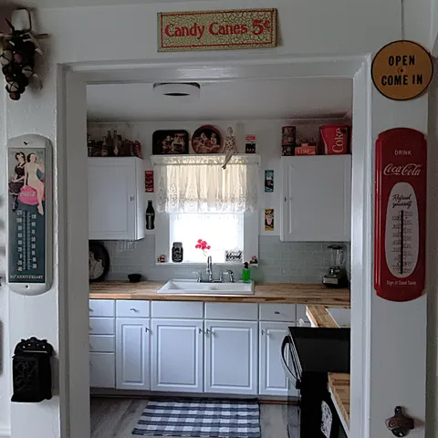 a kitchen with stainless steel appliances a refrigerator and cabinets