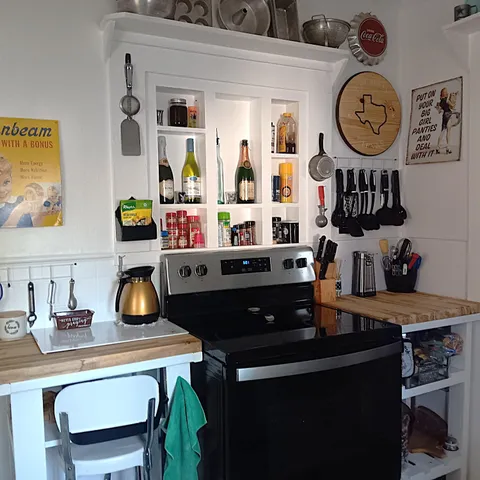 a kitchen with a window a sink and cabinets