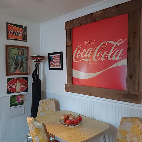 a bathroom with a toilet and a shower curtain
