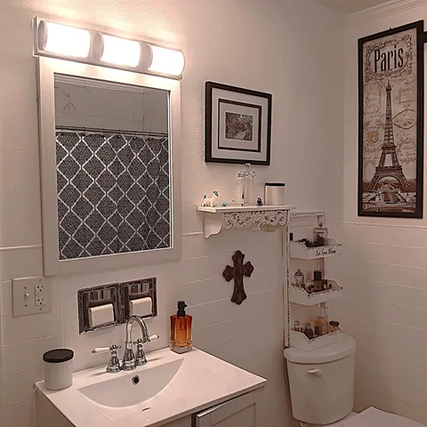 a view of a yard with a table and chairs under an umbrella