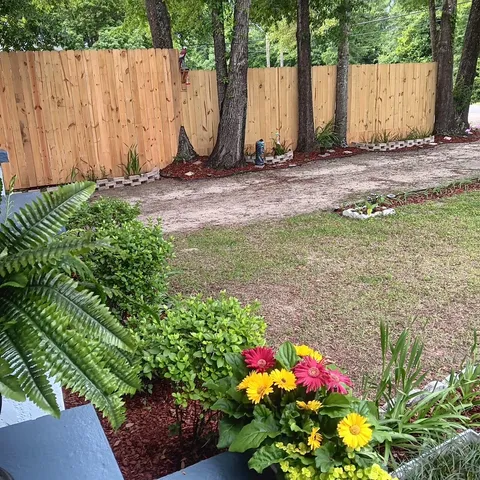 a view of a garden with sitting area