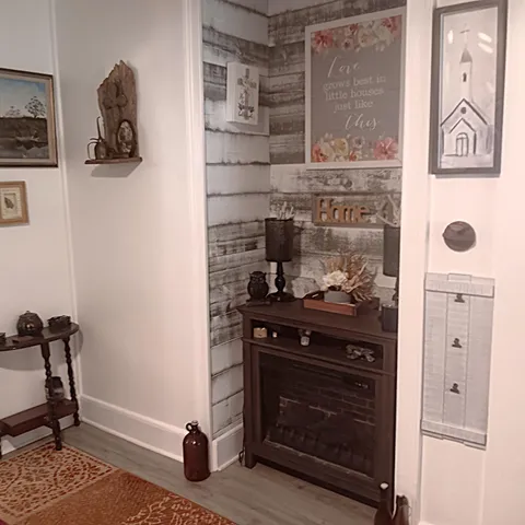 a view of a dining room with a table and chairs