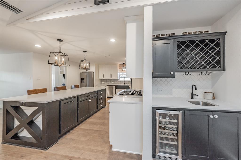 322 Canyon Ridge Drive Richardson, TX 75080 - Photo 16 of 33 a kitchen with a sink cabinets and window