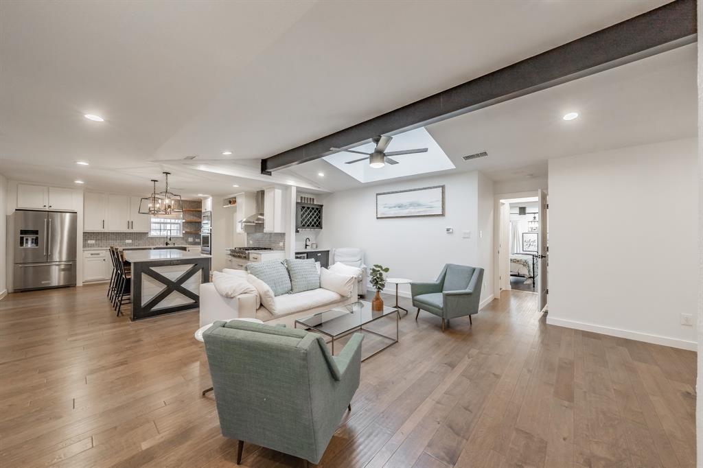 322 Canyon Ridge Drive Richardson, TX 75080 - Photo 8 of 33 a living room with furniture and a wooden floor