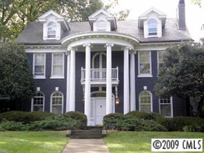 a front view of a building with garden