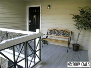 607 Queens Road, Unit E Charlotte, NC 28207 - Photo 8 of 8 a view of entryway and hall with wooden floor
