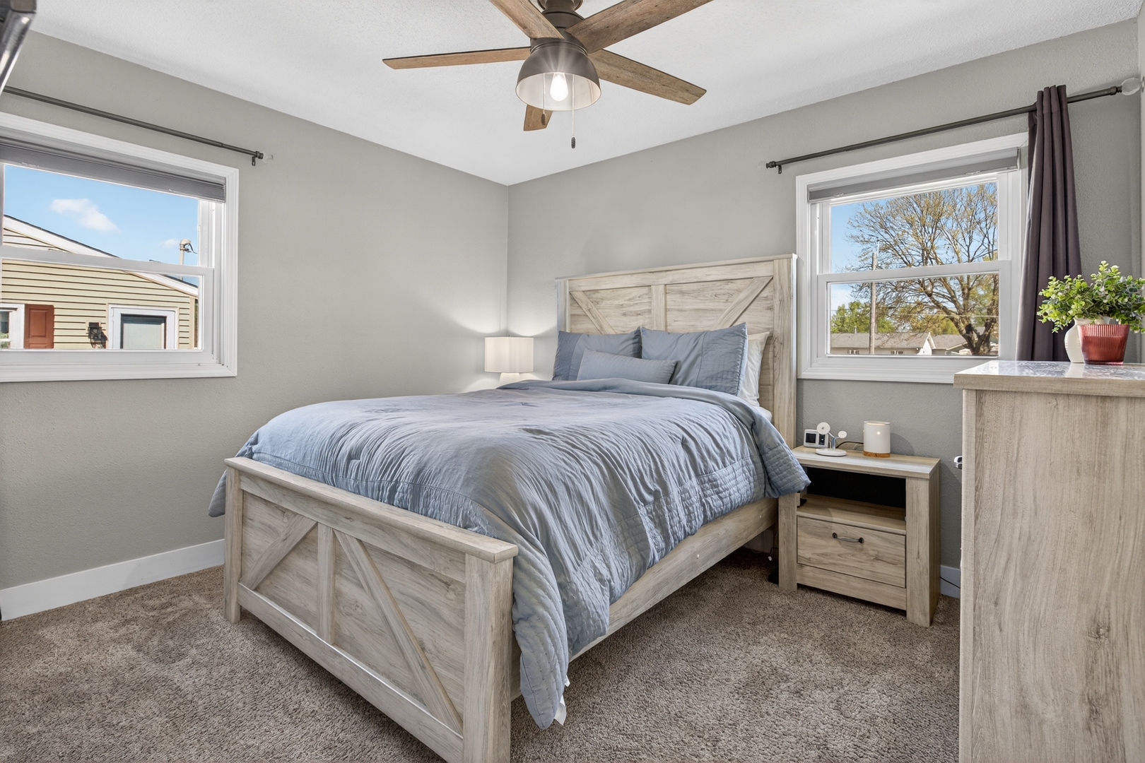 602 14th Place Camanche, IA 52730 - Photo 16 of 23 a bedroom with a bed and a painting on the wall