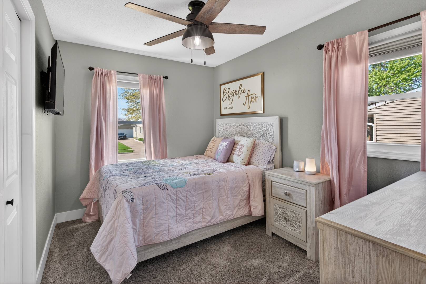 602 14th Place Camanche, IA 52730 - Photo 17 of 23 a bedroom with a bed and a chandelier