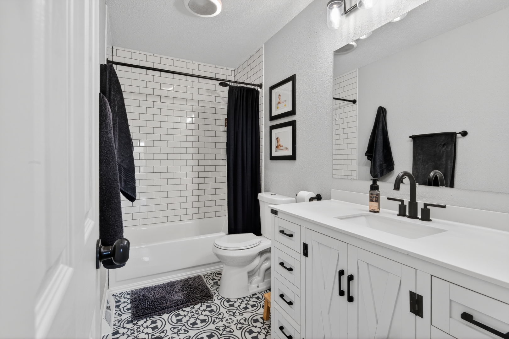 602 14th Place Camanche, IA 52730 - Photo 19 of 23 a bathroom with a sink toilet and shower