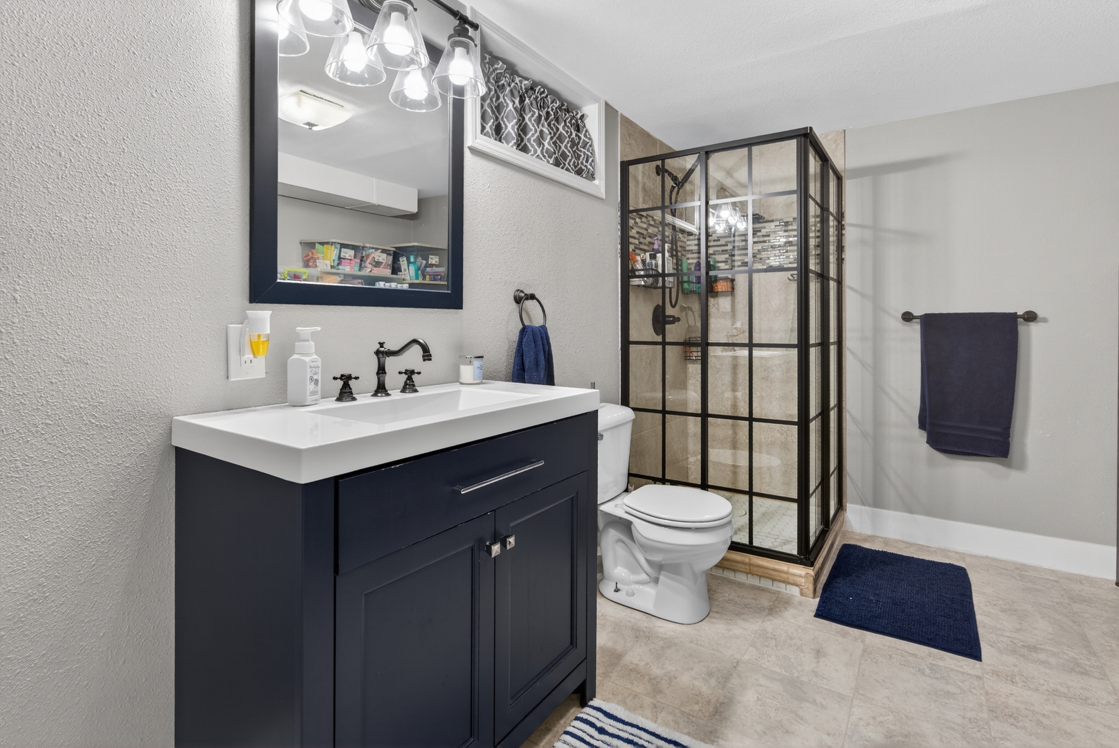 602 14th Place Camanche, IA 52730 - Photo 20 of 23 a bathroom with a sink toilet and shower