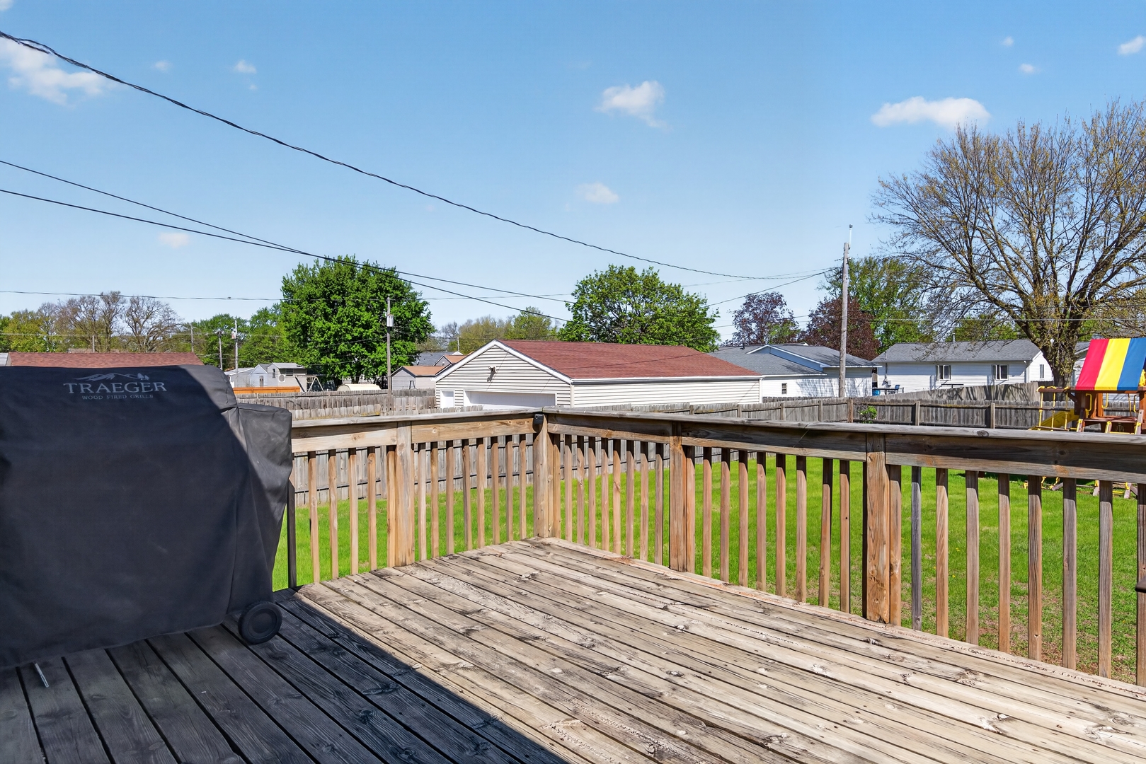 602 14th Place Camanche, IA 52730 - Photo 6 of 23 a view of a wooden deck with a yard