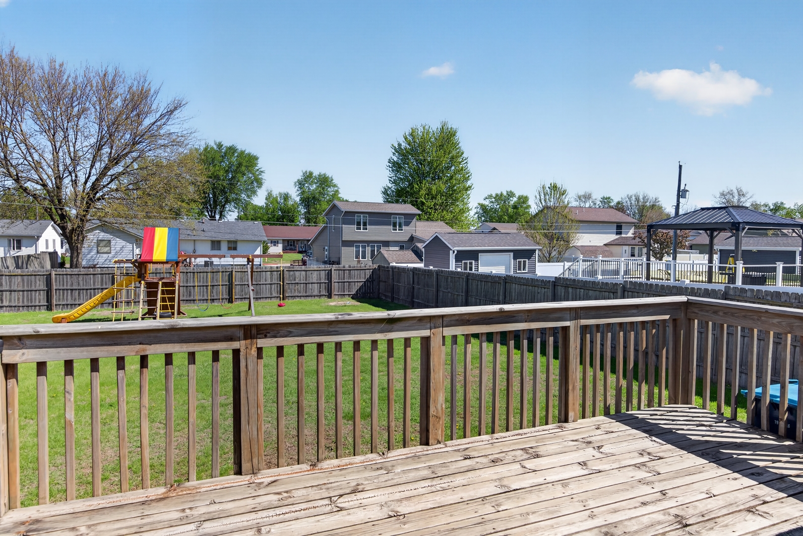 602 14th Place Camanche, IA 52730 - Photo 7 of 23 a view of a wooden deck and city view