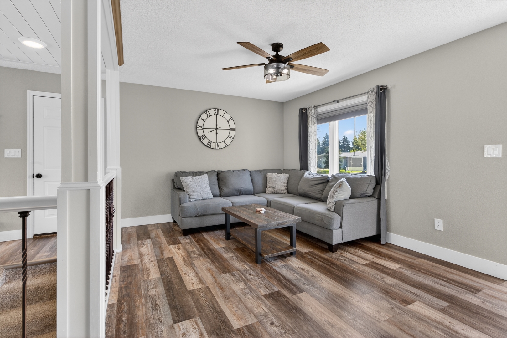 602 14th Place Camanche, IA 52730 - Photo 10 of 23 a living room with furniture and a ceiling fan