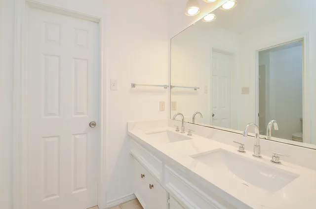 a bedroom with bed and a couch