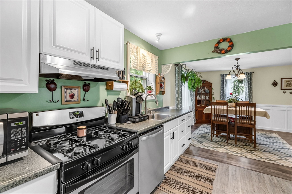 302 Middlefield Road Chester, MA 01011 - Photo 6 of 42 a kitchen with stainless steel appliances granite countertop a stove a sink and a refrigerator