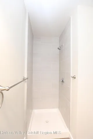 a picture of a bathroom with a shower