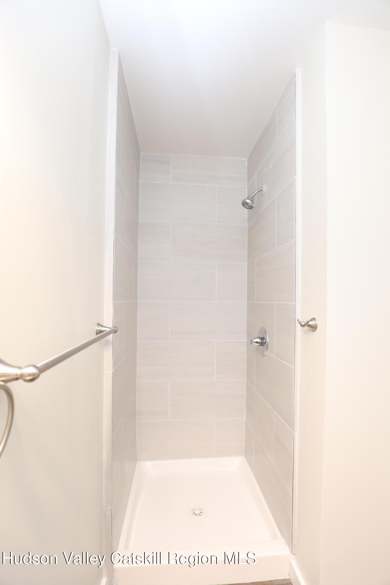 14311 Rte 9W, Unit 1 Ravena, NY 12143 - Photo 4 of 9 a picture of a bathroom with a shower