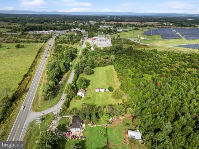 a view of a garden with a building in the background