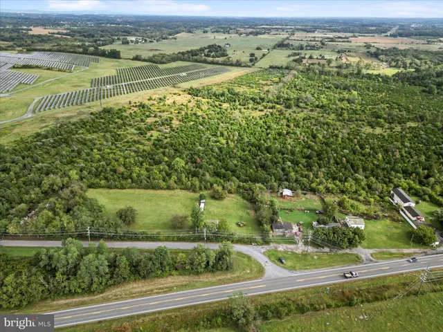 an aerial view of a residential houses with outdoor space