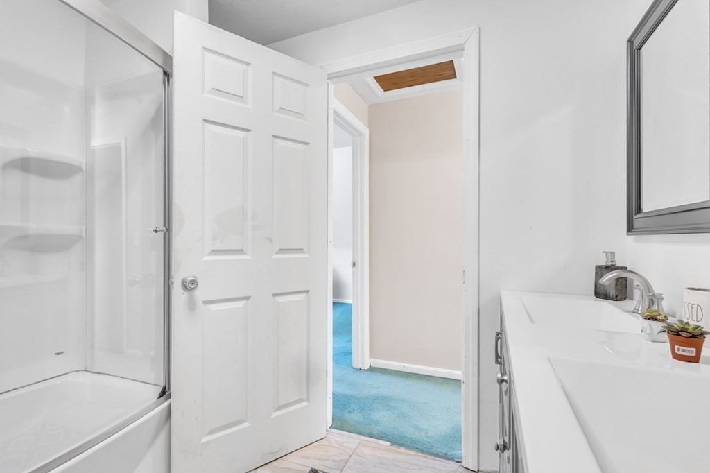1638 Parker Street Springfield, MA 01128 - Photo 18 of 36 a bathroom with a sink and shower