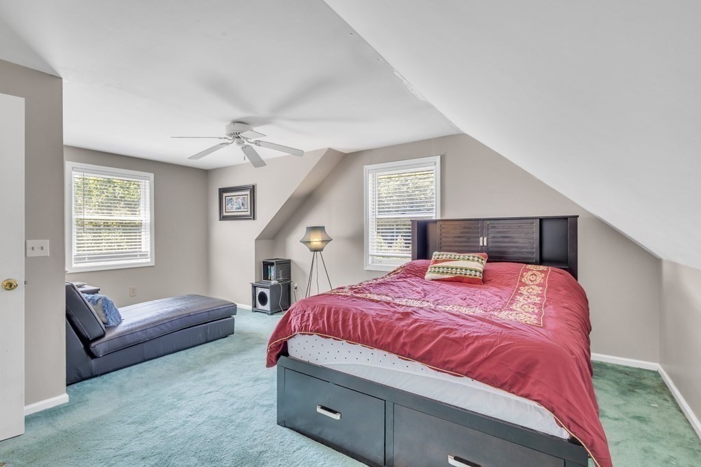 1638 Parker Street Springfield, MA 01128 - Photo 19 of 36 a bedroom with a bed couch and windows