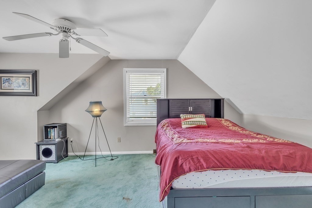 1638 Parker Street Springfield, MA 01128 - Photo 20 of 36 a bedroom with a bed and a night stand