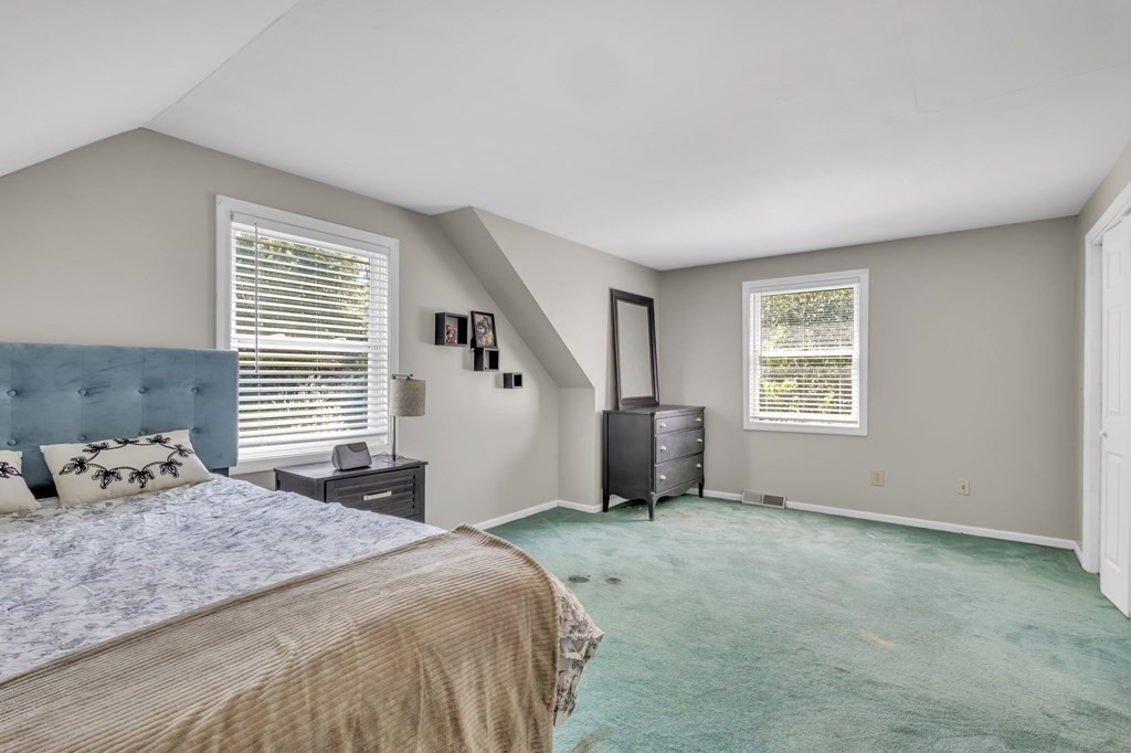 1638 Parker Street Springfield, MA 01128 - Photo 22 of 36 a bedroom with a bed and a window