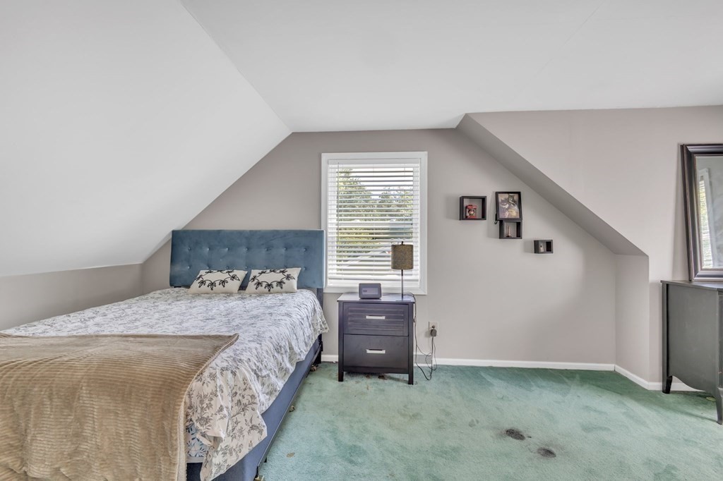 1638 Parker Street Springfield, MA 01128 - Photo 23 of 36 a bedroom with a bed and a window
