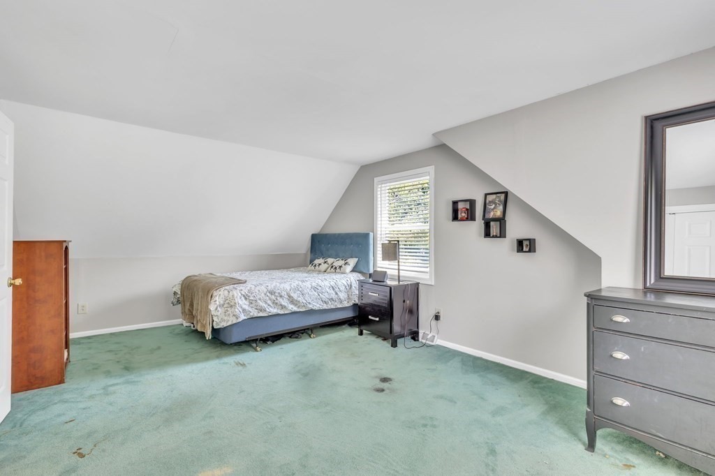 1638 Parker Street Springfield, MA 01128 - Photo 24 of 36 a bedroom with a bed and a window