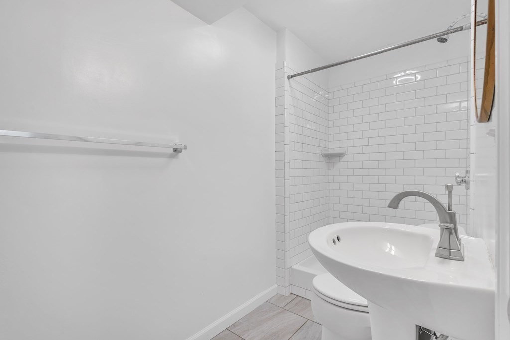 1638 Parker Street Springfield, MA 01128 - Photo 28 of 36 a bathroom with a sink and shower