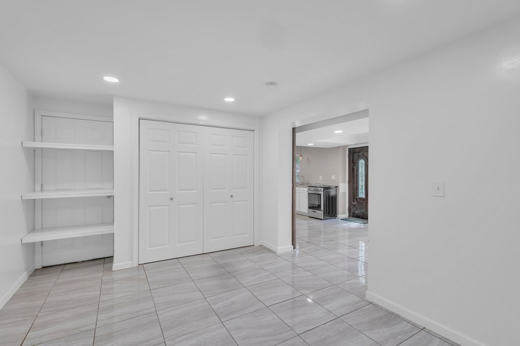 1638 Parker Street Springfield, MA 01128 - Photo 31 of 36 a view of a hallway with an empty room and closet