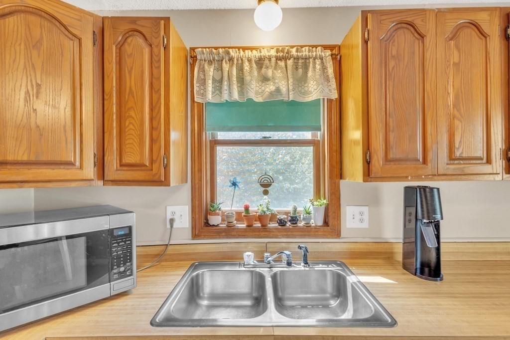 1638 Parker Street Springfield, MA 01128 - Photo 5 of 36 a kitchen with a sink and a window
