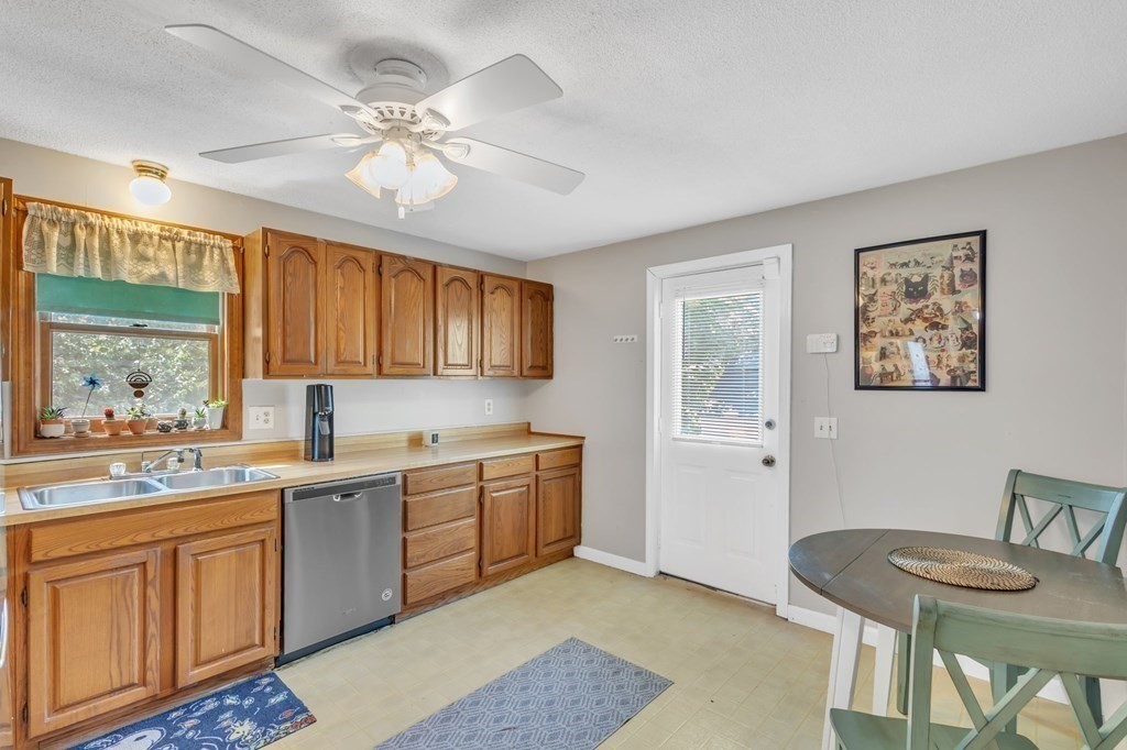 1638 Parker Street Springfield, MA 01128 - Photo 6 of 36 a kitchen with a sink stove and cabinets